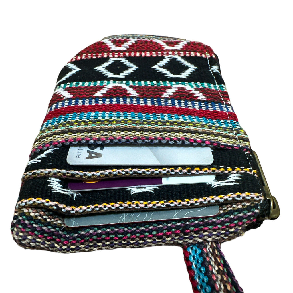 Multicolored woven wallet with strap and zipper with card slots on a white background