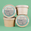 Three containers of Rock Creek Soaps Sugar Scrub on a green background