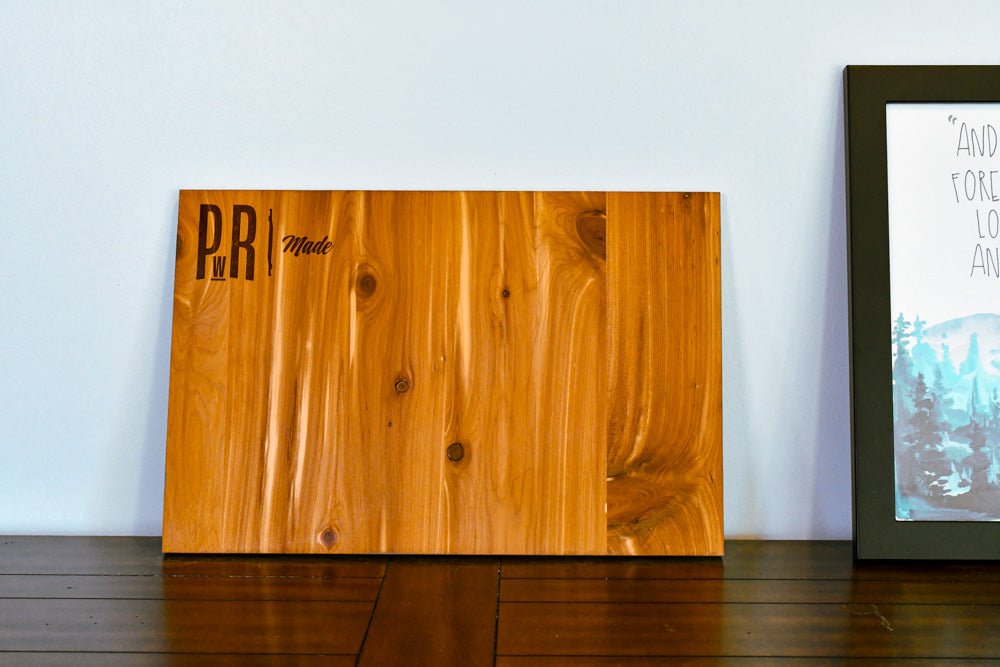 Wooden magnetic board with 'P&R Made' branding on a wooden surface.